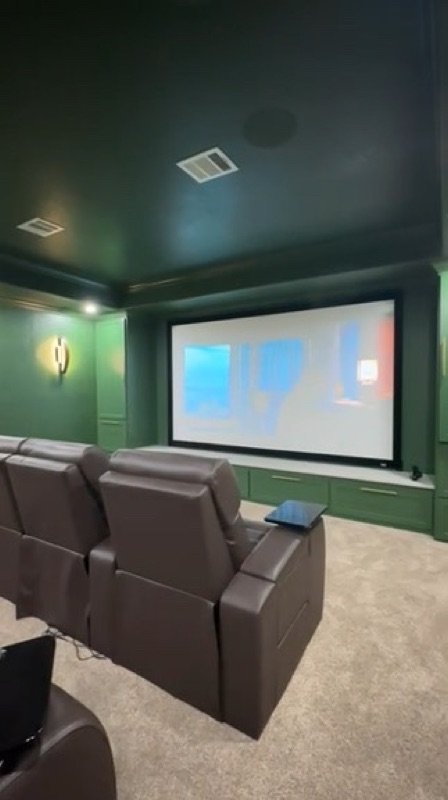 Luxury Green Home Theater with Leather Seating